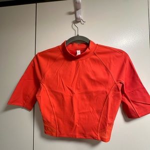 Orange red lululemon workout top